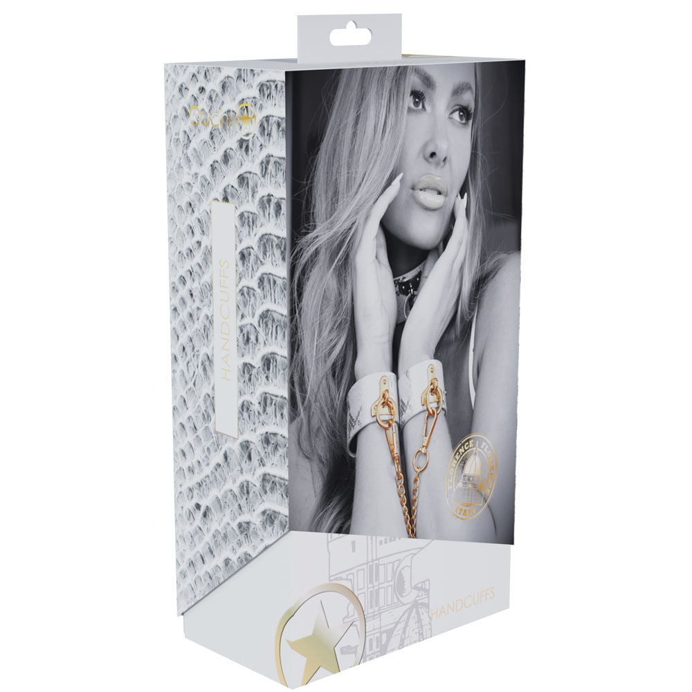Elegant white faux leather bondage handcuffs with gold chain and snakeskin pattern, perfect for stylish bedroom restraint play, box view | Flirty Bay online adult store, adult toys and lingerie